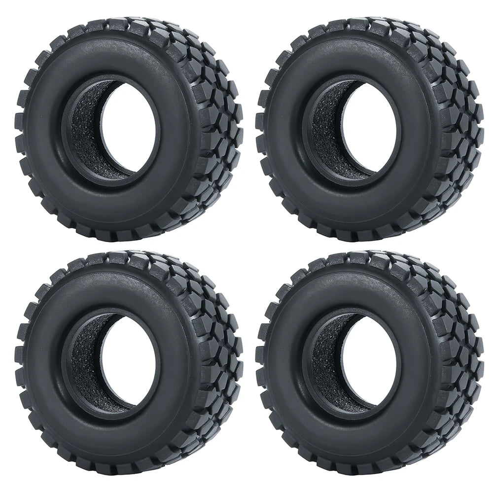 Four black soft rubber tires for 1/18 and 1/24 RC crawler cars shown from the top view.