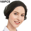 A woman is modeling a black disposable non-woven bouffant cap with an elastic band on her head.