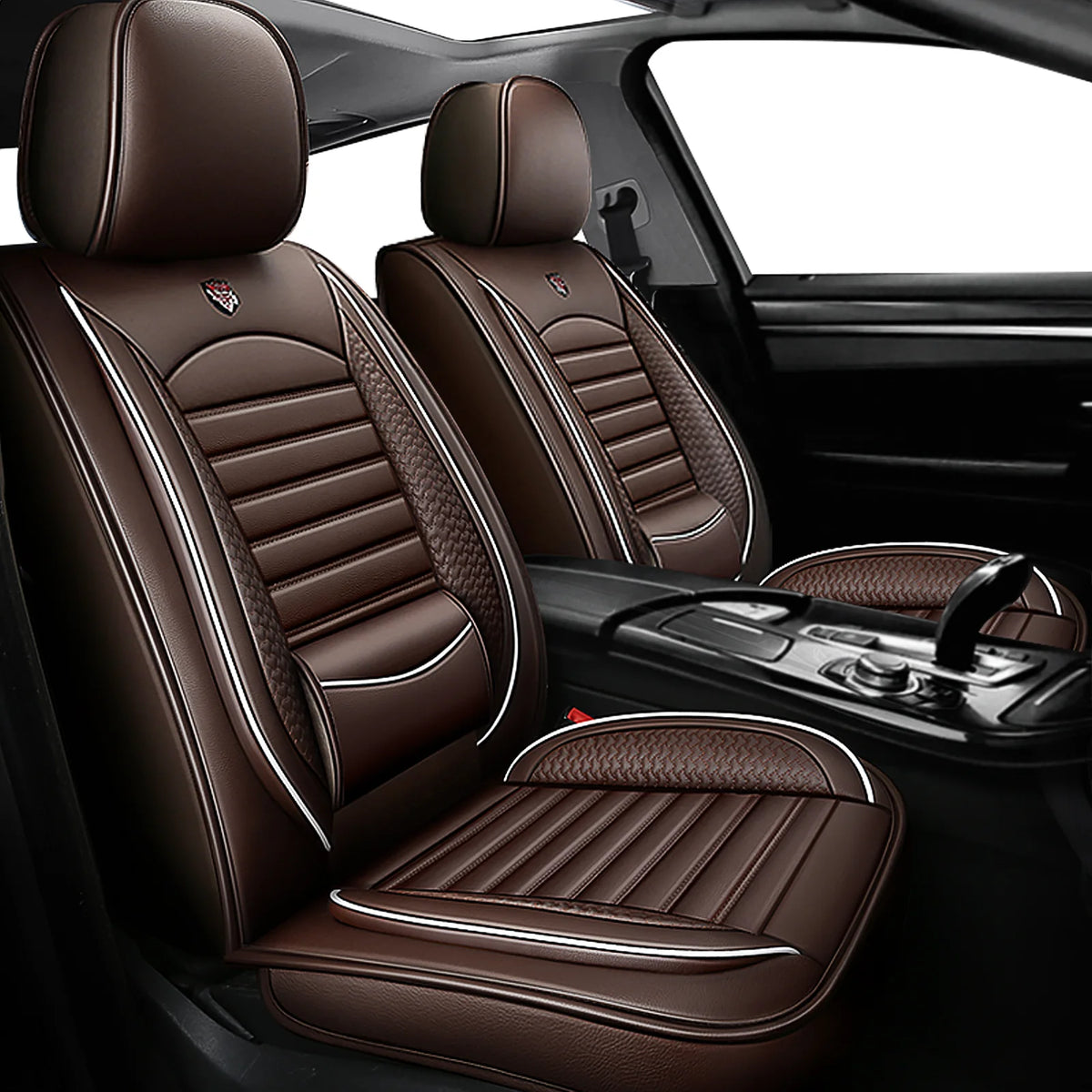 Brown leather car seat covers with stitching and headrests shown inside a vehicle.
