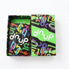 A box of Omega Card Game featuring colorful, abstract patterns and the brand name DNUP.