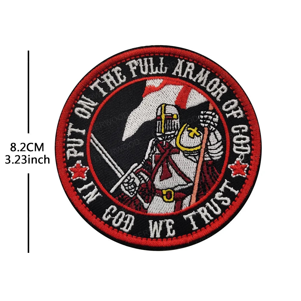 Embroidered patch featuring a knight in armor with a sword and mace, surrounded by text on a black background.