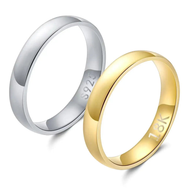 A pair of gold and silver wedding bands displayed on a white background.
