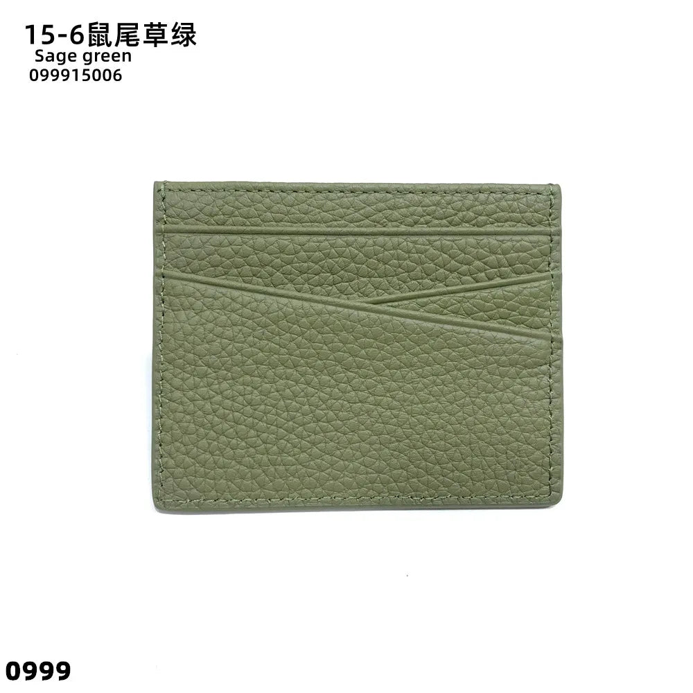 A rectangular sage green genuine leather slim card holder wallet.