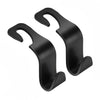 A set of four black car seat headrest hooks designed for organizing bags and belongings.