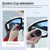 A suction cup adsorption blind spot mirror is shown being used to wipe a car rearview mirror clean.
