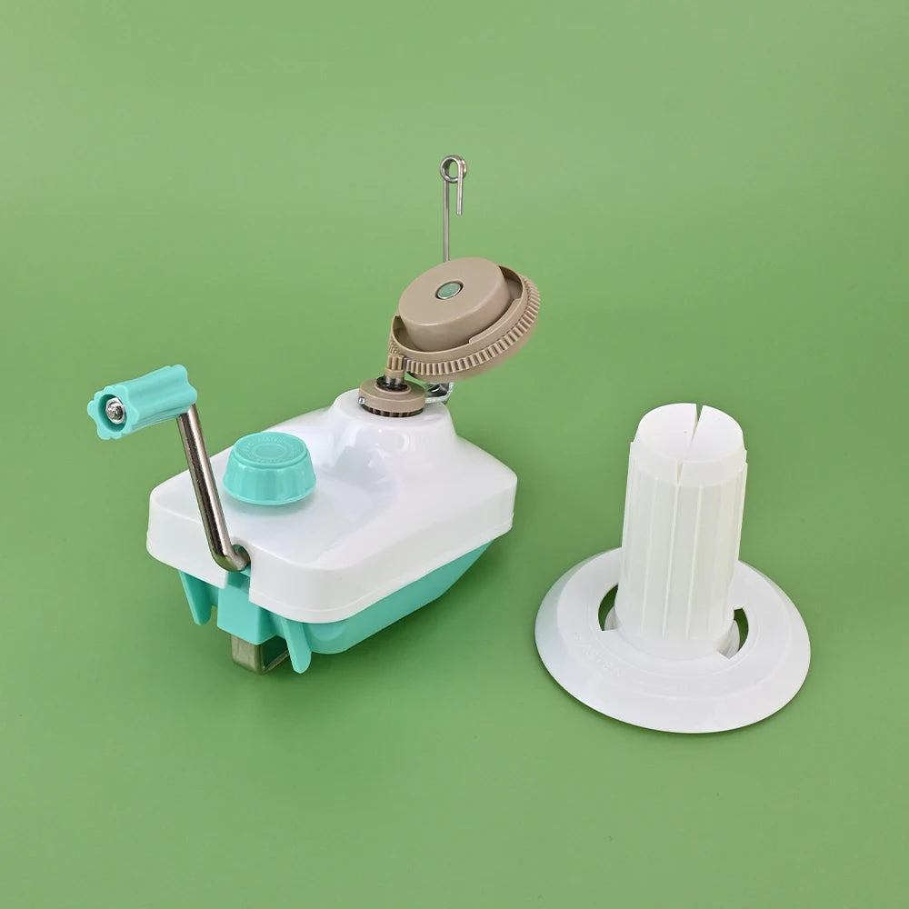 A hand crank yarn winder for knitting and crochet, featuring a white and teal mechanism and a white spindle.