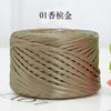 A ball of metallic flat ribbon yarn used for crochet and knitting.
