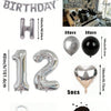 A kit for creating a balloon garland featuring silver and black foil numbers and balloons.