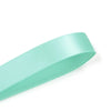 A roll of mint green double face satin ribbon.