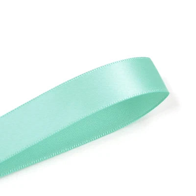A roll of mint green double face satin ribbon.