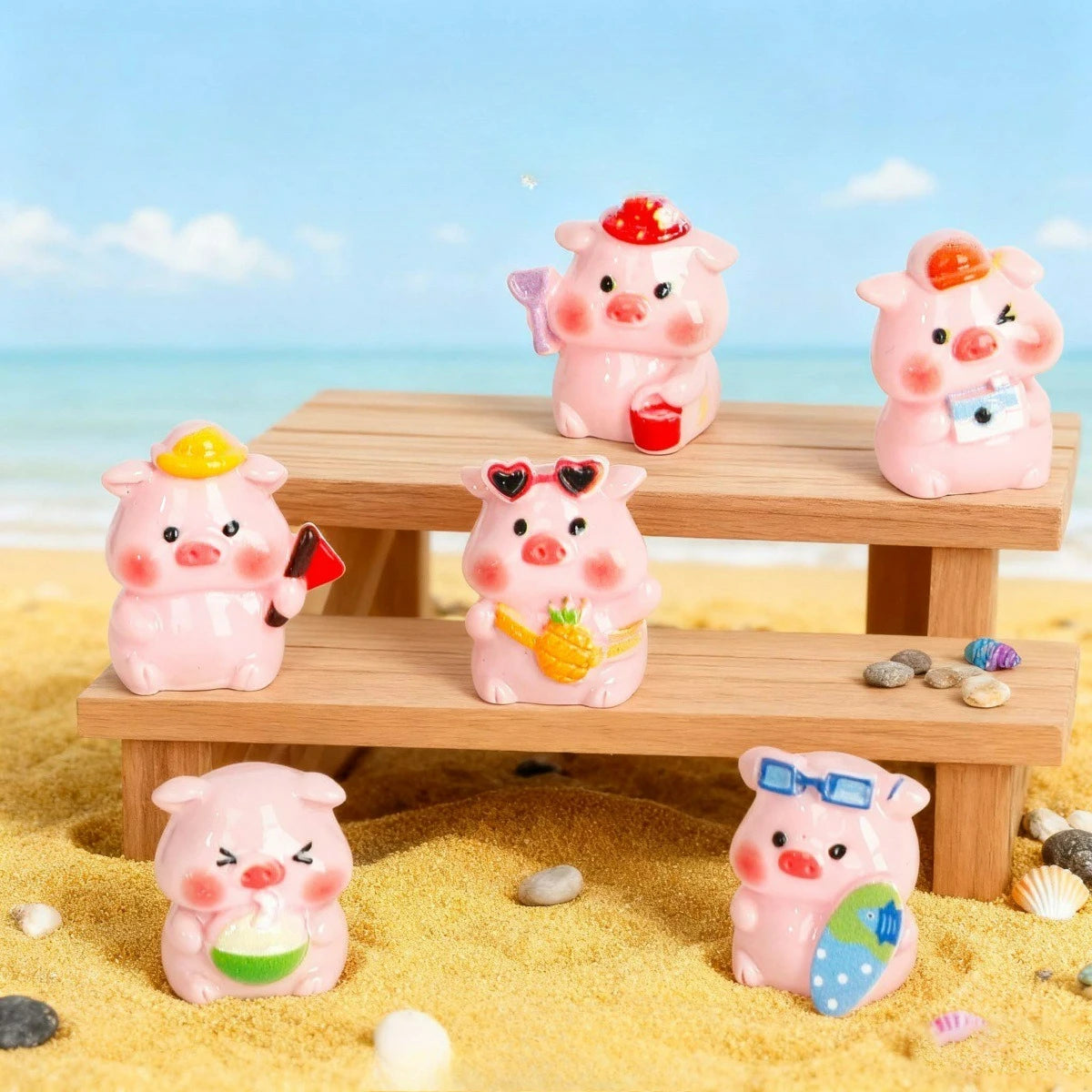 Pink resin pig figurines in various poses sitting on wooden planks amidst yellow sand