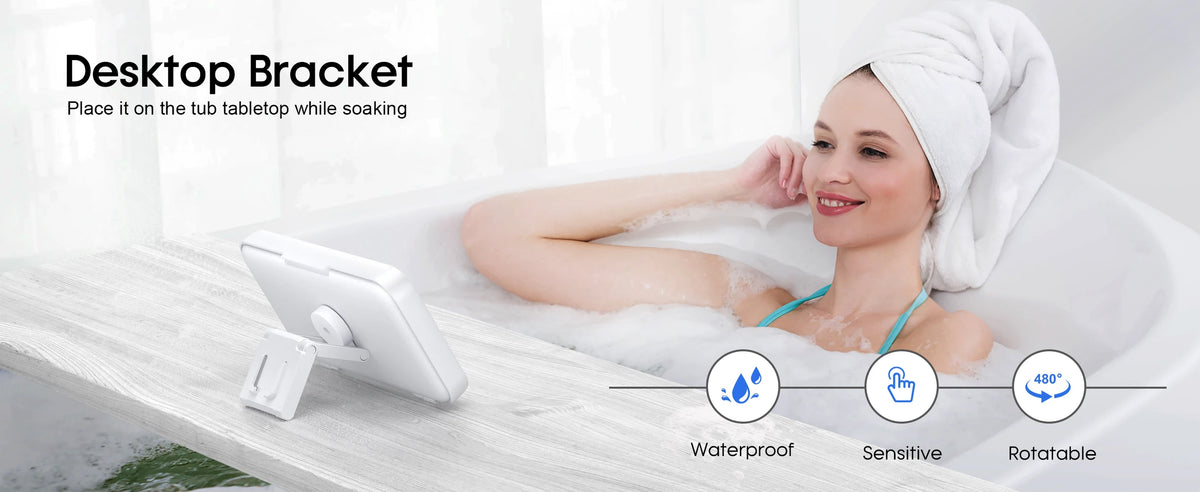 A woman is soaking in a bathtub with a waterproof phone bracket placed on the tub tabletop.