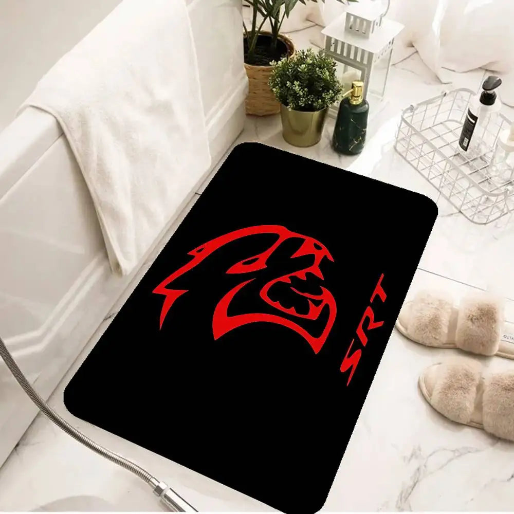 A black silicone mat with a red stylized lion head design is placed on a white marble surface.