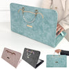 A teal laptop briefcase with a leather trim and silver chain detail is shown in various angles.