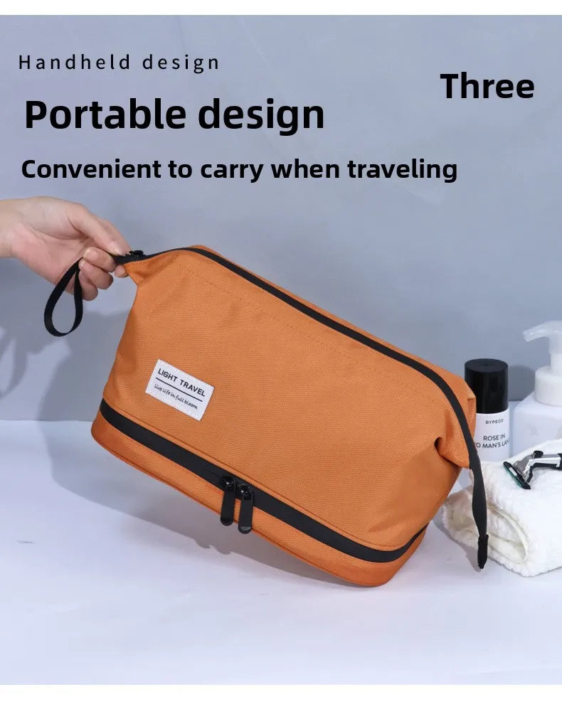 An orange handheld portable toiletry bag is being held by a hand, demonstrating its convenient design for traveling.