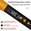 Close-up of a black soldering iron displaying 500°C, showing temperature control features and power switch indicators.