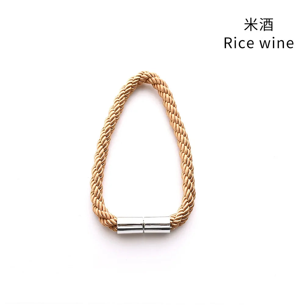 A set of two magnetic curtain tiebacks featuring a natural rope texture and silver metal clasp.