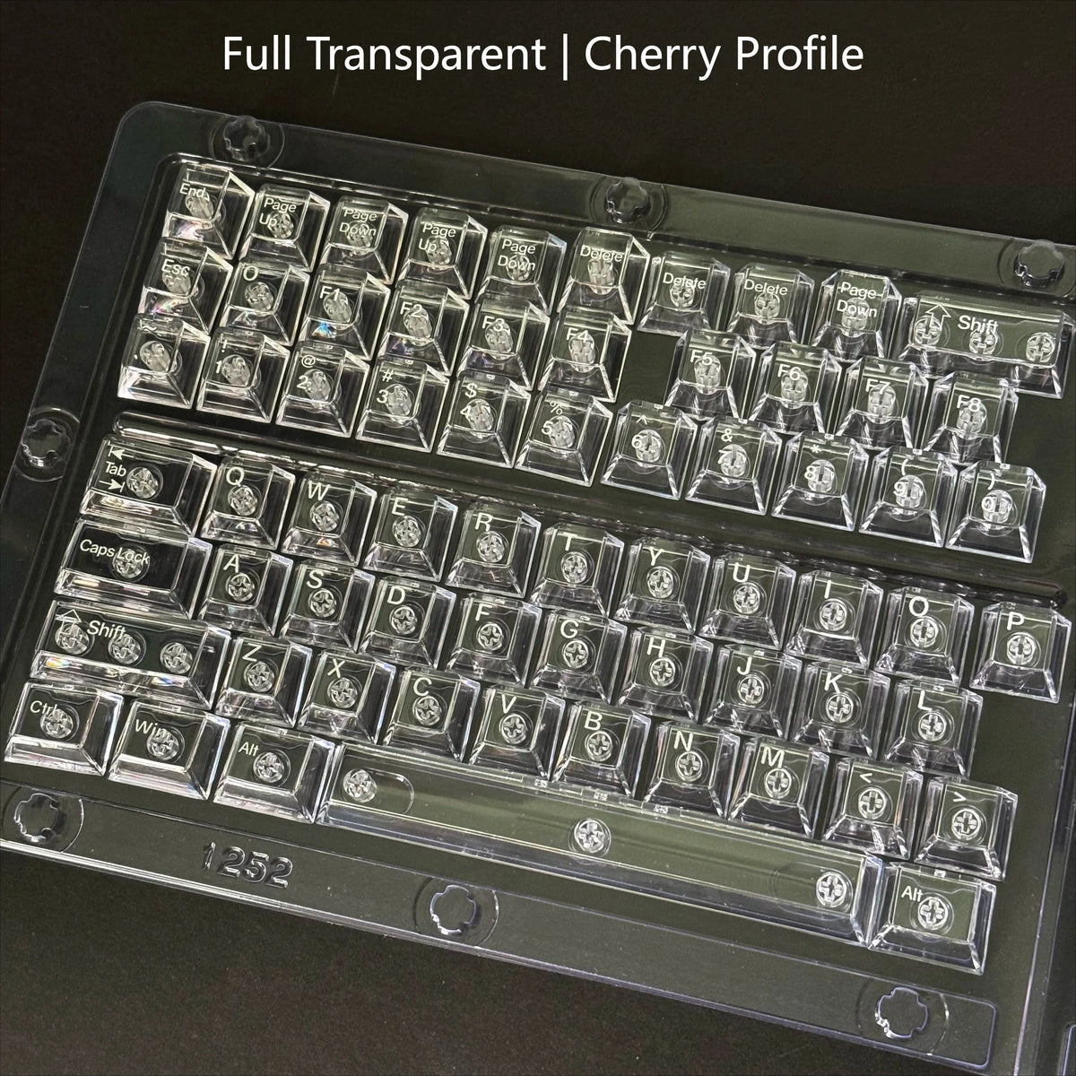 A close-up view of a full transparent cherry profile keycap set for a mechanical keyboard.