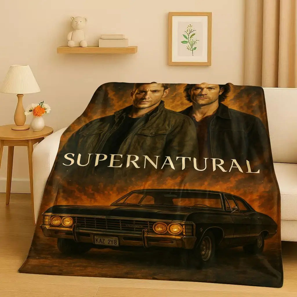 A dark blanket featuring characters and a classic car, inspired by the Supernatural TV show.