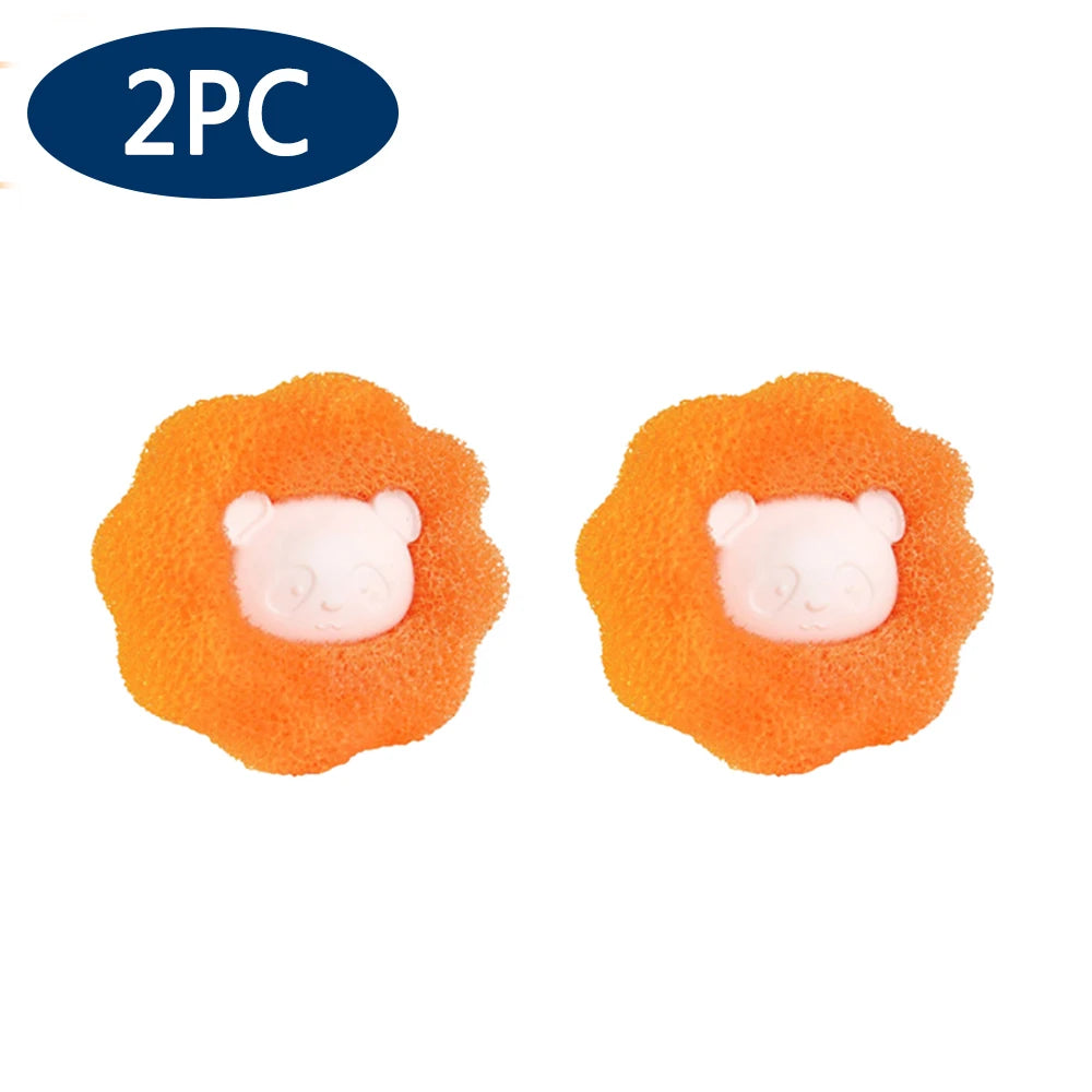 Two orange reusable laundry balls designed for pet hair and lint removal