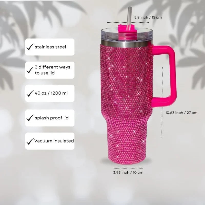 A pink rhinestone bling tumbler with a straw and handle, showing various features like stainless steel construction and vacuu