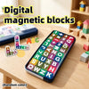 A colorful set of digital magnetic blocks featuring letters and numbers stored in a blue box on a wooden table.