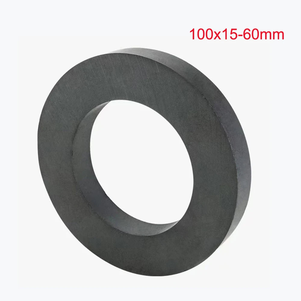 A black ceramic ring magnet with a center hole, measuring 100x15-60mm.