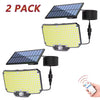 A set of two solar-powered motion sensor security flood lights, one with a dark panel and one with a yellow panel, shown with