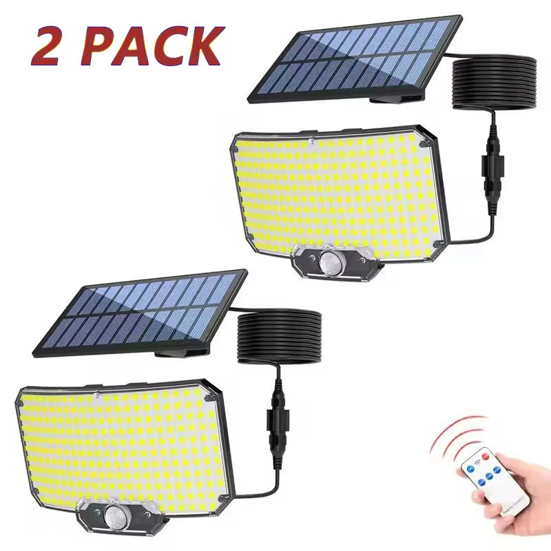 A set of two solar-powered motion sensor security flood lights, one with a dark panel and one with a yellow panel, shown with