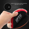 A hand is holding a black and red wool polishing pad with a hook and loop design for car care.