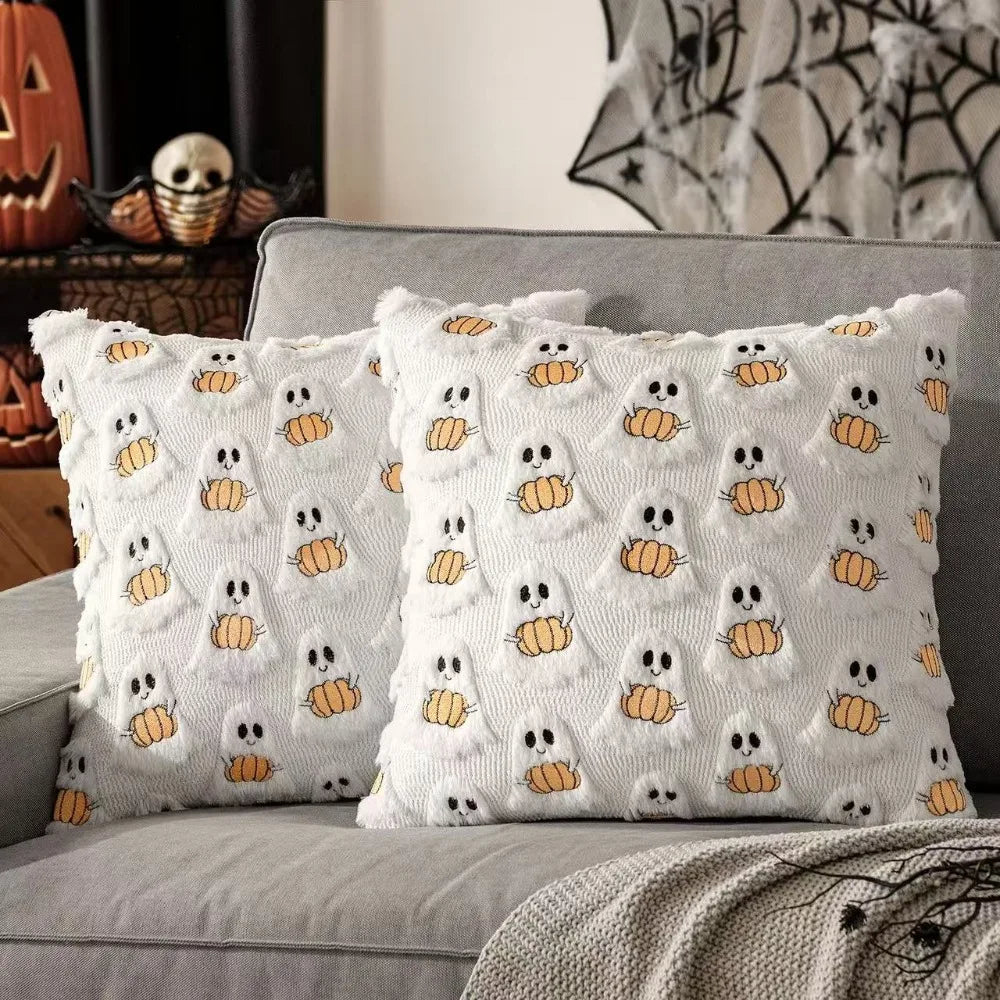 White throw pillow cover featuring a pattern of small yellow Halloween ghosts and pumpkins