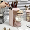 Clear acrylic hair accessories organizer with rotating compartments and various brushes and tools