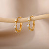 Boucles d'oreilles créoles en zircon cubique ton or