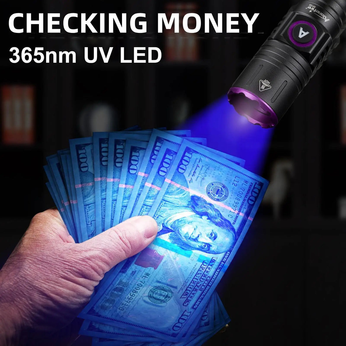 A hand holds a stack of US dollar bills under the beam of a 365nm UV LED flashlight.