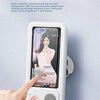 A hand touches a white waterproof shower phone holder with a smartphone displaying a woman's face.