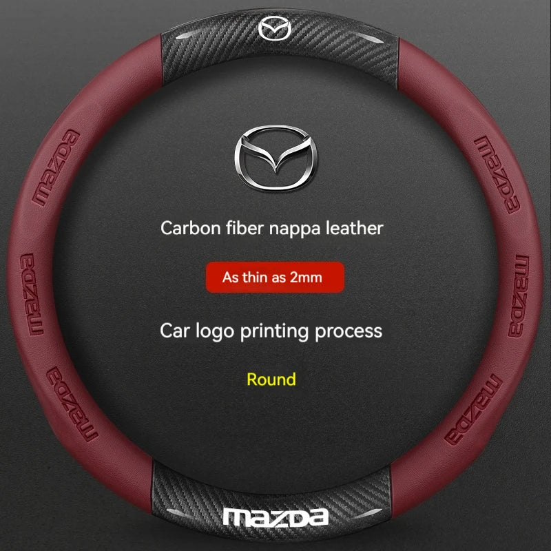 A round red carbon fiber leather steering wheel cover for a Mazda vehicle.