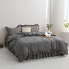 A black and white plaid duvet cover set with matching pillowcases displayed on a bed.