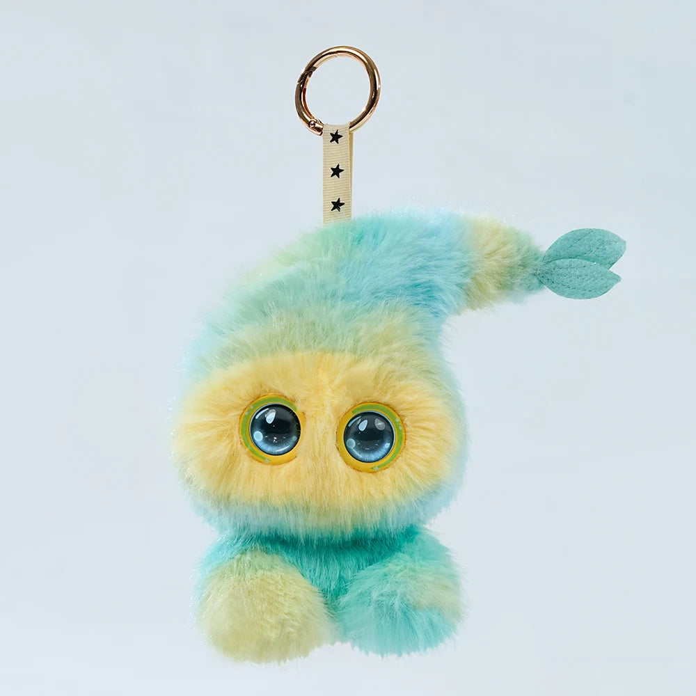A fluffy, light blue and yellow plush robot with large blue LED eyes and a gold keyring.