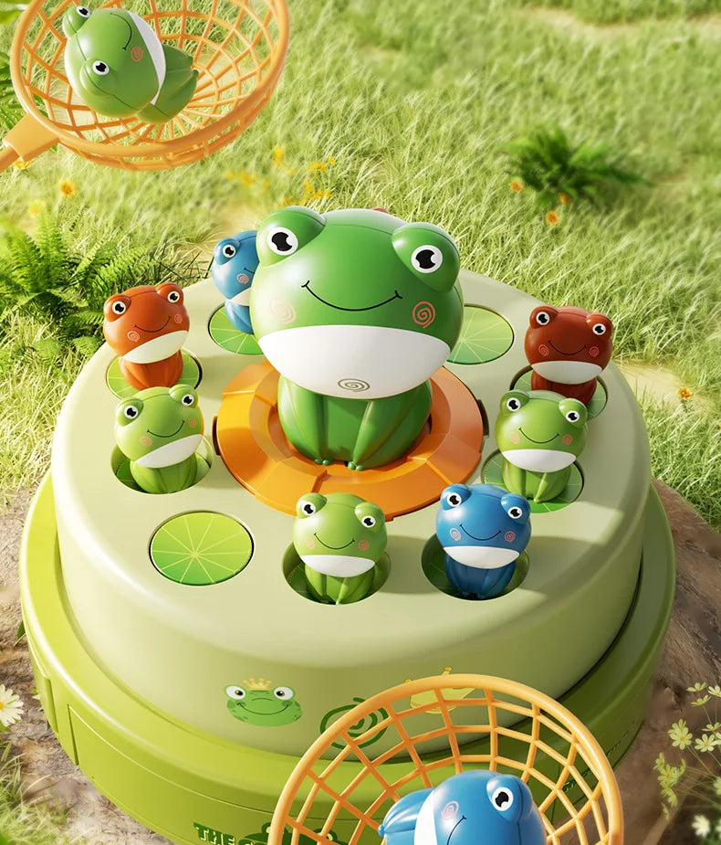 A green frog toy is featured on a tiered platform surrounded by other frogs and a fishing net.