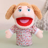 A soft plush hand puppet with light brown hair and a red mouth, wearing a floral patterned shirt.