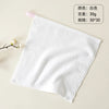 A white, soft organic cotton face towel is shown folded on a light background.