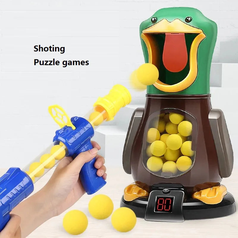 A hand is holding a blue dart gun aimed at a green duck target, with yellow darts scattered nearby.