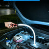 A hand is holding a flexible silicone LED strip lamp inside a car engine bay.