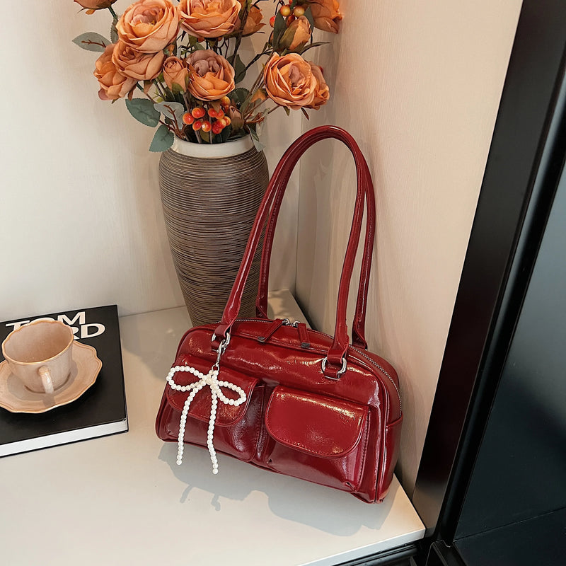 Bolso de hombro suave con detalle de lazo