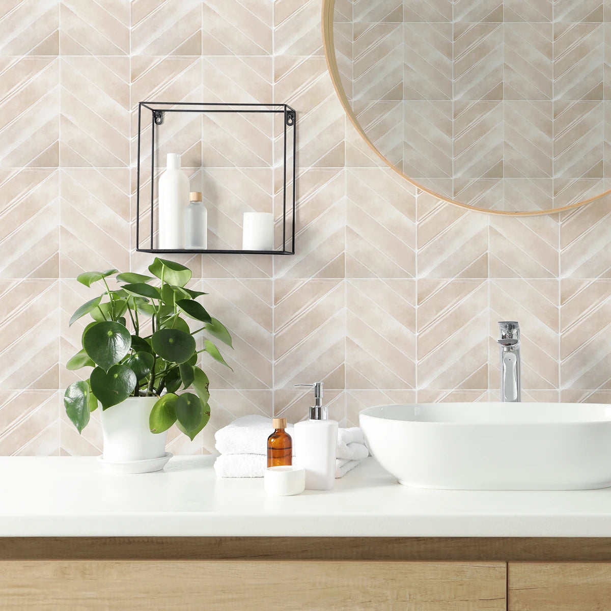 A bathroom vanity featuring a white vessel sink, wooden countertop, and decorative wall tiles with a circular mirror.