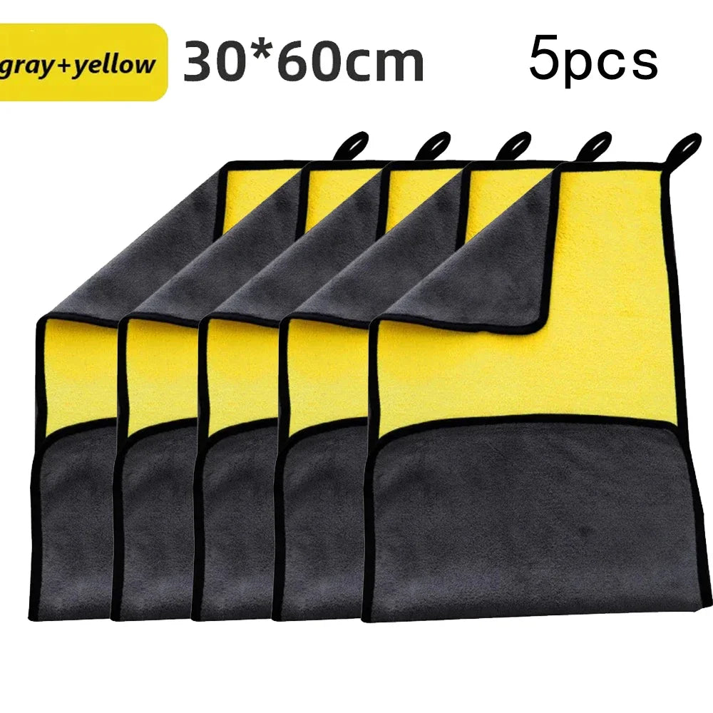 Five gray and yellow microfiber car cleaning towels displayed in a row.