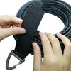 Hands are holding a black heavy-duty nylon cord organizer strap with a triangle buckle.