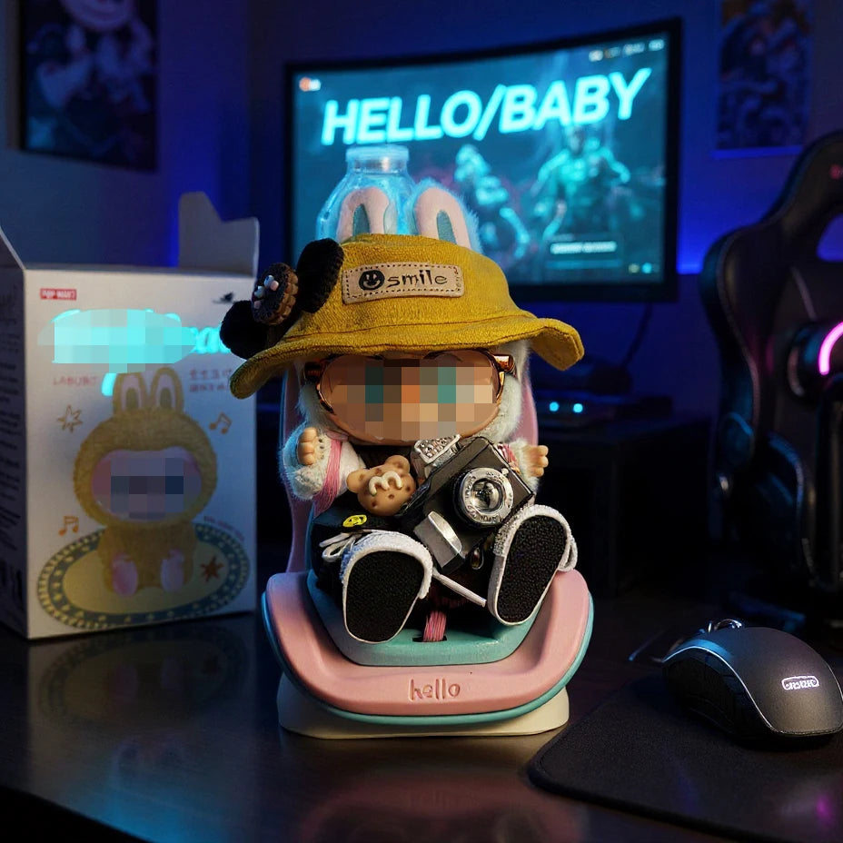 A yellow Labubu-inspired car seat accessory with a storage clip sits on a dark surface.