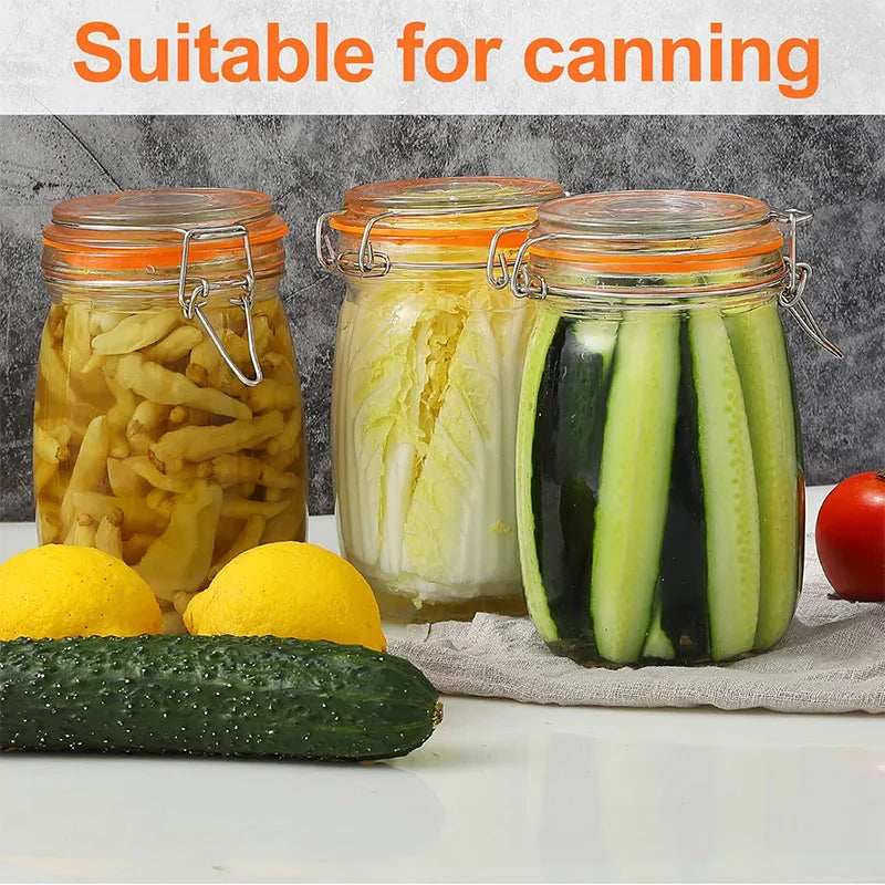 Glass mason jars filled with preserved food like pickles and cucumbers suitable for canning