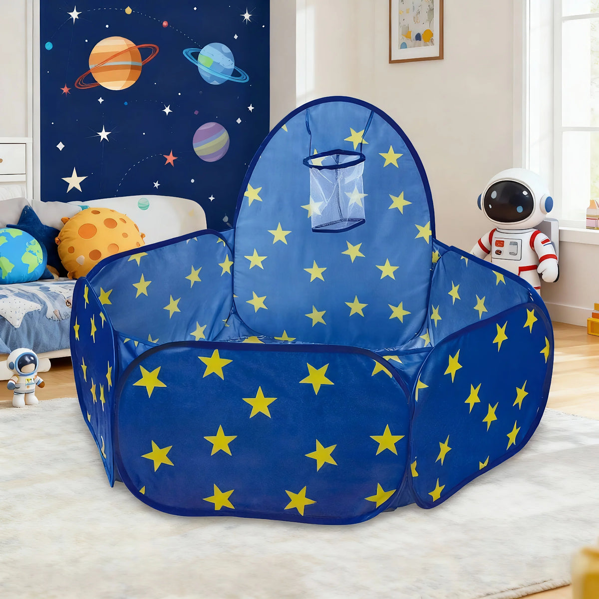 A blue foldable pop-up play tent with yellow stars for kids displayed indoors.